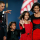 President-elect Barack Obama—along with his wife, Michelle, and daughters, Sasha (second from left) and Malia—acknowledges his supporters during an election night gathering in Grant Park in Chicago Nov. 4, 2008.
Scott Olson/Getty Images